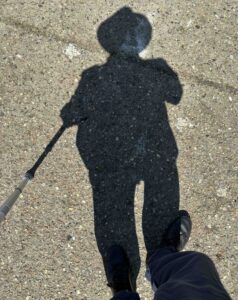 my shadow on the ground, with walking stick